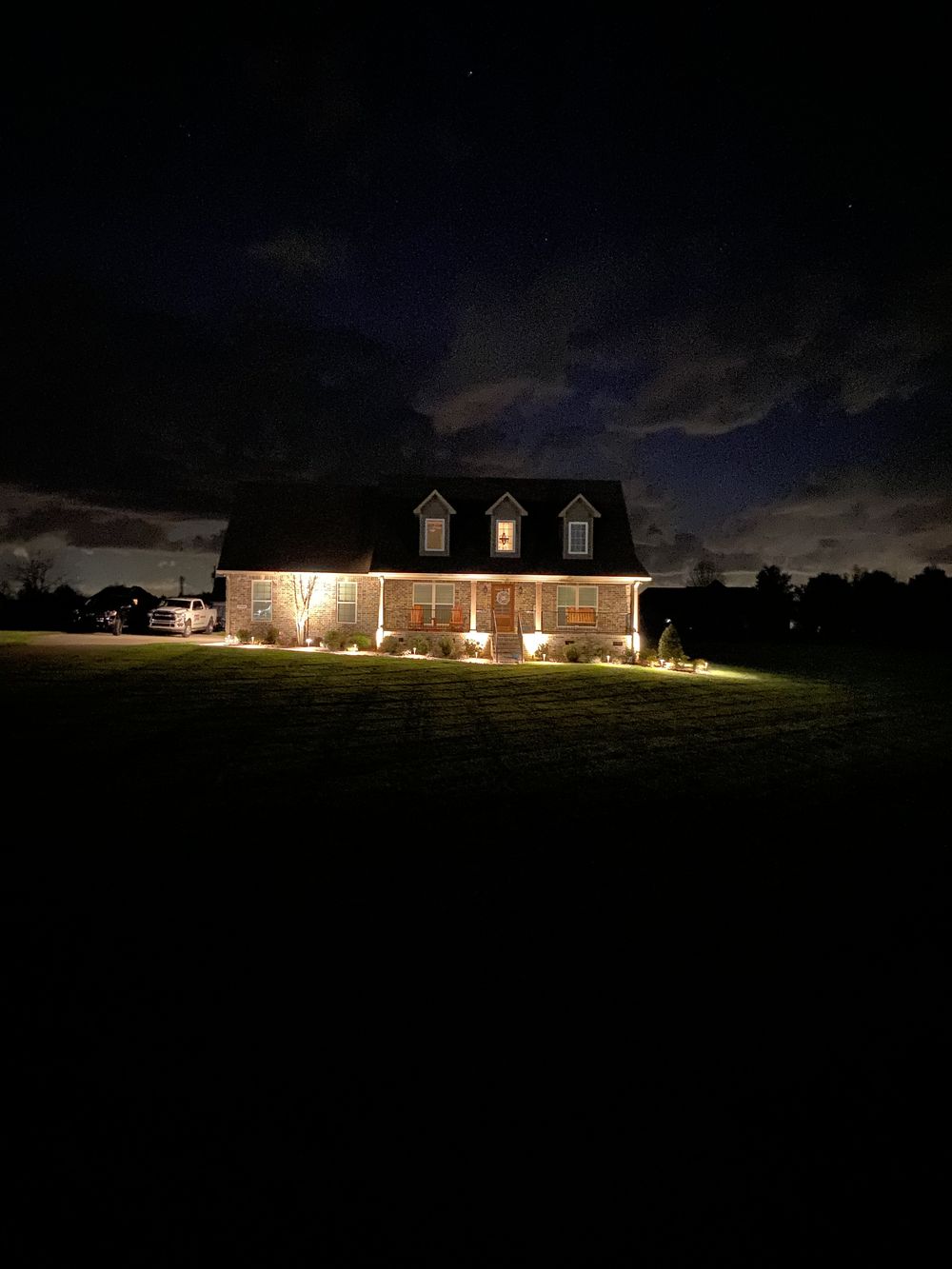 Landscape lighting installation at night